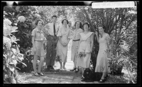 Cazneaux family and spaniel in the front garden at Ambleside, Roseville, New South Wales, Christmas 1935 [picture] / Harold Cazneaux