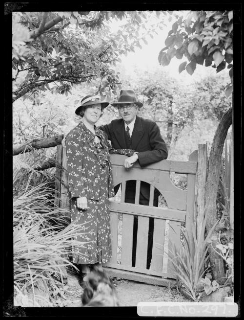 Harold and Winifred Cazneaux standing at a gate at Ambleside, Roseville, New South Wales, Christmas 1936, 1 [picture] / Harold Cazneaux