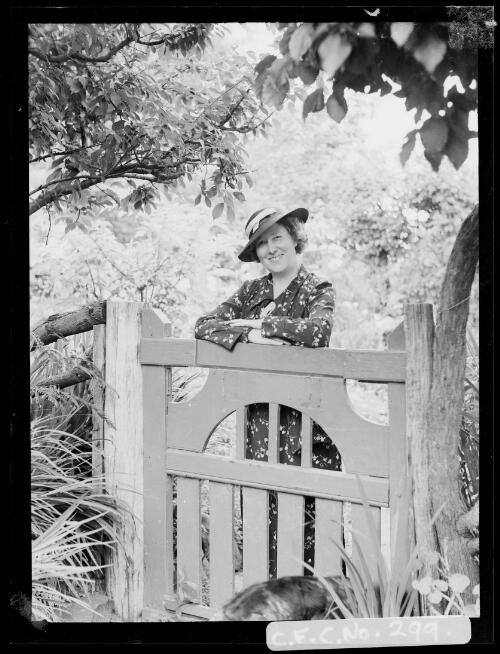 Winifred Cazneaux standing at the studio gate at Ambleside, Roseville, New South Wales, Christmas 1936 [picture] / Harold Cazneaux