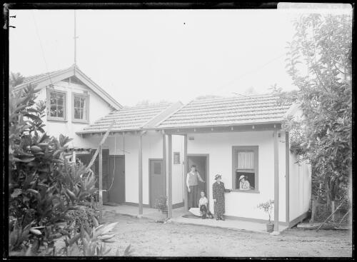 Winifred Cazneaux with her children Harold, Beryl and Jean outside Harold's new room at Ambleside, Roseville, New South Wales, 1936 [picture] / Harold Cazneaux