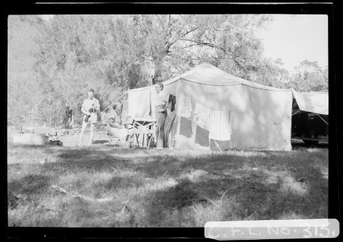 Harold Cazneaux with wife Winifred and son Harold at their camp site in the Flinders Ranges, South Australia, 1937 [picture] / Harold Cazneaux