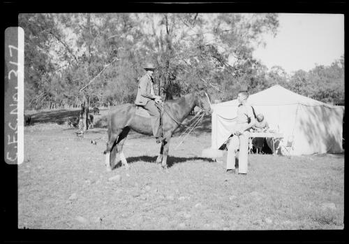 George Hunt on a horse and young Harold Cazneaux at the Cazneaux's camp site in the Flinders Ranges, South Australia, 1937 [picture] / Harold Cazneaux