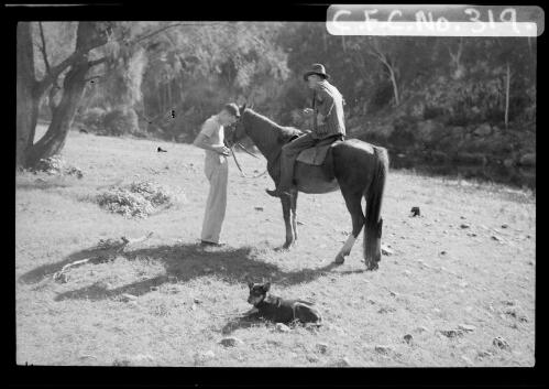George Hunt on a horse with the young Harold Cazneaux and dog, Flinders Ranges, South Australia, 1937 [picture] / Harold Cazneaux