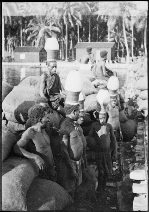 Five men wearing Ombu, ceremonial headwear, Soraken, Bougainville Island,  ca. 1929 [picture] / Sarah Chinnery