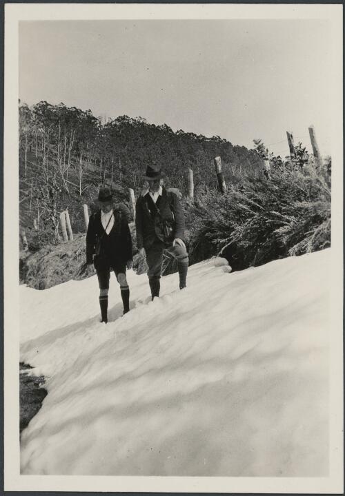 Charles Studdy Daley and an unidentified man walking in snow, ca. 1925 [picture]