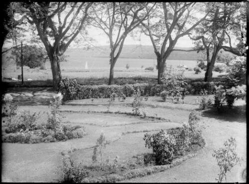 View across Chinnery's garden towards the harbour, Malaguna Road, Rabaul, New Guinea, ca. 1936 [picture] / Sarah Chinnery