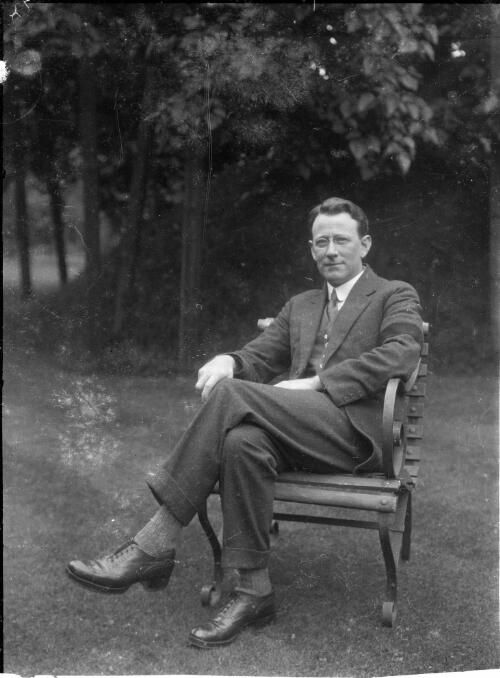 Portrait of unidentified man seated in a garden chair, England, ca. 1920 [picture] / Sarah Chinnery