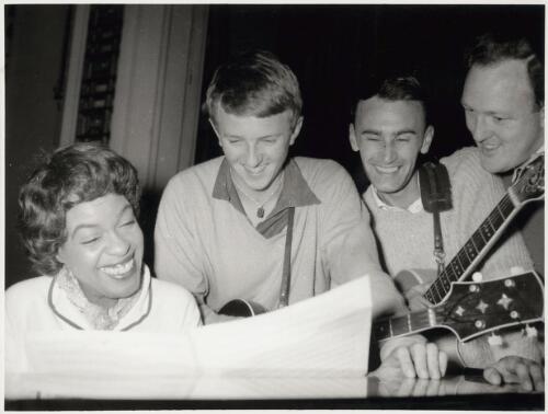 Winifred Atwell practicing with three other musicians [picture]