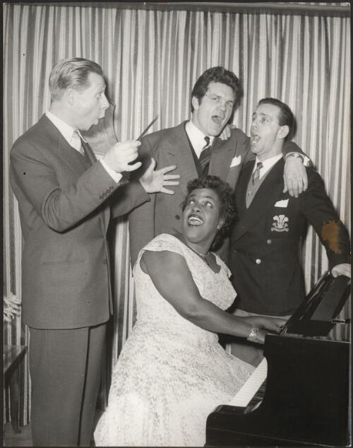 Winifred Atwell singing with three men [picture]
