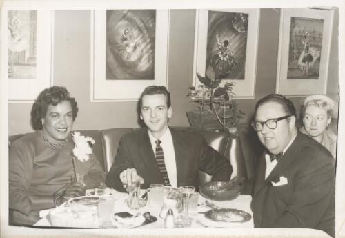 Winifred Atwell with an unidentified man [centre] and her husband Lew Levisohn [right] at a restaurant [picture]