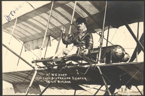 Mr. W.E. Hart, the first Australian aviator in his biplane, [seated at controls, 1911?] [picture] / J.L. Turner