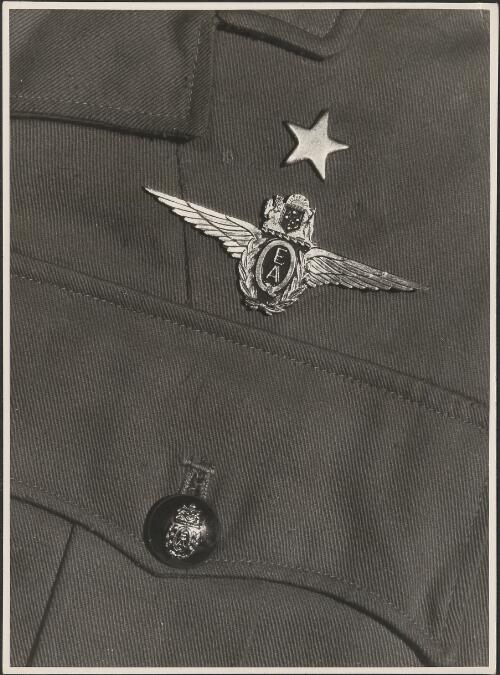 Pocket on Qantas uniform showing L.R.O. star, wings and button, April 1945 [picture] / Richard McKinney