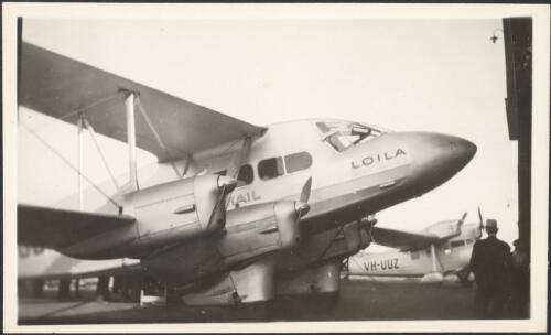 De Havilland DH 86a passenger biplane (VH-UUB), Loila, with Tugan LJW 7 Gannett monoplane (VH-UUZ) in background, Mascot, 1935 [picture]