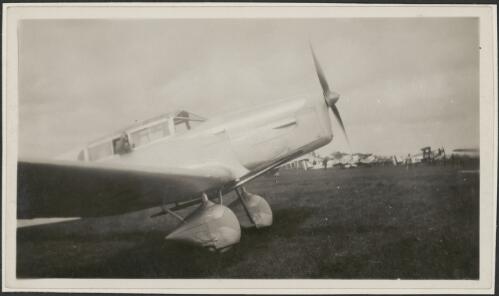Frank Neale's Percival Gull on ground with various  aircraft in background, 193- [picture]