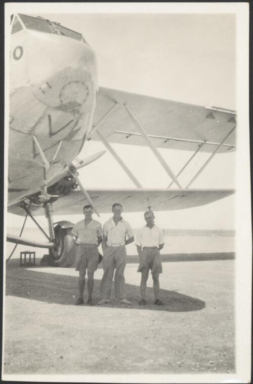 Stableford, Horning and E.A. Crome standing in front of Hanno (G-AAUD), a Handley Page H.P. 42 biplane airliner, ca. 1930s [picture]