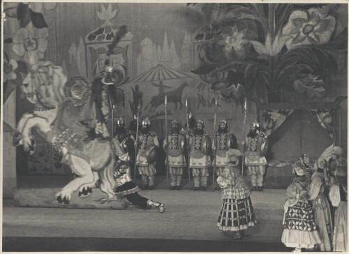 Dimitri Rostoff as King Dodon (on the horse), Marian Ladre as Commander-in-Chief Polkan (at horse's rear), Irina Zarova as Dodon's Nurse Amelpha (front row left), and artists of the company, in Le coq d'or, Original Ballet Russe, Australian tour, His Majesty's Theatre, Melbourne, June 1940 (1) [picture] / Hugh P. Hall