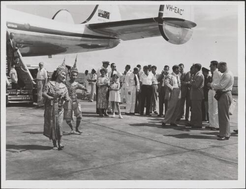 Thai dancers greeting the arrival of the first Qantas Constellation (VH-EAC) at Donmuang Airport, Bangkok, 16 November 1953 [picture]
