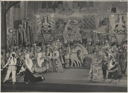 Olga Morosova as The Queen of Shamakhan (front row far left), H. Algeranoff as The Astrologer (kneeling front row), Dimitri Rostoff as King Dodon (front row second from right), Marian Ladre as Commander-in-Chief Polkan (front row far right), and artists of the company, in Le coq d'or, Original Ballet Russe, Australian tour, His Majesty's Theatre, Melbourne, June 1940 [picture] / Hugh P. Hall