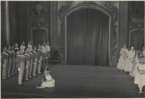 David Lichine as a cadet (front in second cadet row from right),  Tatiana Leskova as a junior girl (sitting centre), Tatiana Riabouchinska as a junior girl (far right front), and artists of the company, in Graduation ball, The Original Ballet Russe, Australian tour, His Majesty's Theatre, Melbourne, 1940 (2) [picture] / Hugh P. Hall