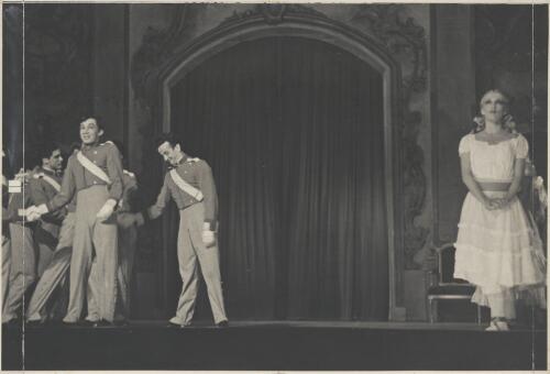 David Lichine as a cadet (front row left), Sviatslow Toumine (?) as a cadet (front row second from left), Tatiana Riabouchinska as a junior girl (far right front), and artists of the company, in Graduation ball, The Original Ballet Russe, Australian tour, His Majesty's Theatre, Melbourne, 1940 (2) [picture] / Hugh P. Hall