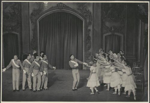 David Lichine as a cadet (centre), Tatiana Riabouchinska as a junior girl (centre taking Lichine's hand), and artists of the company, in Graduation ball, The Original Ballet Russe, Australian tour, His Majesty's Theatre, Melbourne, 1940 [picture] / Hugh P. Hall