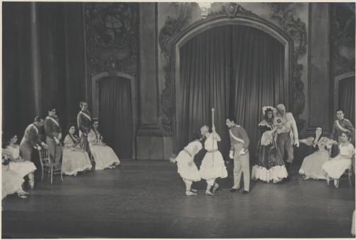 Tatiana Riabouchinska as a junior girl (centre holding staff), David Lichine as a cadet (centre), Borislav Runanine as the Head Mistress (fifth from left), Igor Schwezoff as the Old General (fourth from left), and artists of the company,  in Graduation ball, The Original Ballet Russe, Australian tour, His Majesty's Theatre, Melbourne, 1940 [picture] / Hugh P. Hall