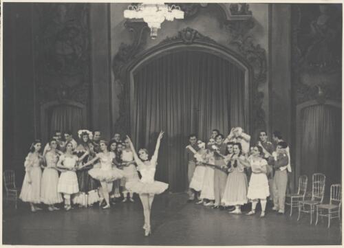 Borislav Runanine as the Head Mistress (centre of group on left), Genevieve Moulin as a Dance-step Competitor (centre of group on left wearing tutu), Alexandra Denisova as a Dance-step Competitor (centre front), David Lichine as a junior cadet (centre of group on right), Igor Schwezoff as the Old General (centre rear of group on right with hands on head), and artists of the company, in Graduation ball, The Original Ballet Russe, Australian tour, His Majesty's Theatre, Melbourne, 1940 [picture] / Hugh P. Hall