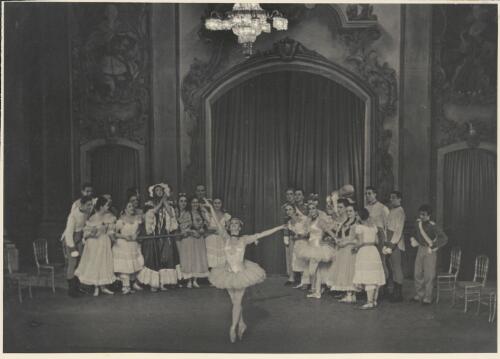 Borislav Runanine as the Head Mistress (centre of group on left), Genevieve Moulin as a Dance-step Competitor (centre front), Alexandra Denisova as a Dance-step Competitor (front of group on right wearing tutu), Igor Schwezoff as the Old General (centre rear of group on right with head tilted), and artists of the company, in Graduation ball, The Original Ballet Russe, Australian tour, His Majesty's Theatre, Melbourne, 1940 [picture] / Hugh P. Hall