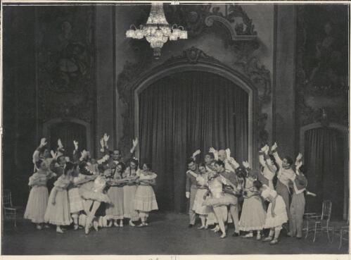 Borislav Runanine as the Head Mistress (centre of group on left with head looking downwards), Genevieve Moulin as a Dance-step Competitor (centre front of group on left wearing tutu), Alexandra Denisova as a Dance-step Competitor (front of group on right wearing tutu), David Lichine as a junior cadet (centre of group on right), Igor Schwezoff as the Old General (centre rear of group on right), and artists of the company, in Graduation ball, The Original Ballet Russe, Australian tour, His Majesty's Theatre, Melbourne, 1940 [picture] / Hugh P. Hall