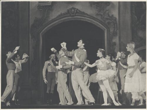 Igor Schwezoff as the Old General (third from left), David Lichine as a junior cadet (centre front), Tatiana Riabouchinska as a junior girl (second from right), Alexandra Denisova as a Dance-step Competitor (front right in tutu), and artists of the company, in Graduation ball, The Original Ballet Russe, Australian tour, His Majesty's Theatre, Melbourne, 1940 [picture] / Hugh P. Hall