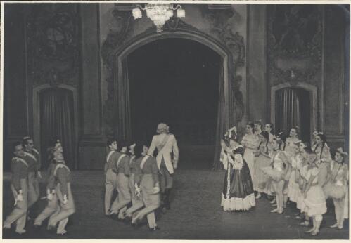David Lichine as a junior cadet (centre front), Igor Schwezoff as the Old General (centre rear), Borislav Runanine as the Head Mistress (centre right), Tatiana Riabouchinska as a junior girl (front of group on right), Genevieve Moulin as a Dance-step Competitor (centre of group on right in tutu), Alexandra Denisova as a Dance-step Competitor (far right in tutu), and artists of the company, in Graduation ball, The Original Ballet Russe, Australian tour, His Majesty's Theatre, Melbourne, 1940 [picture] / Hugh P. Hall
