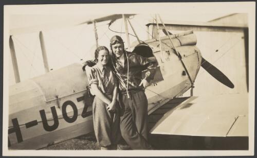Nancy Bird and Jack Kingsford-Smith standing next to a de Havilland DH.60M Moth (VH-UOZ), Mascot [?], New South Wales, ca. 1933, 1 [picture] / E. A. Crome