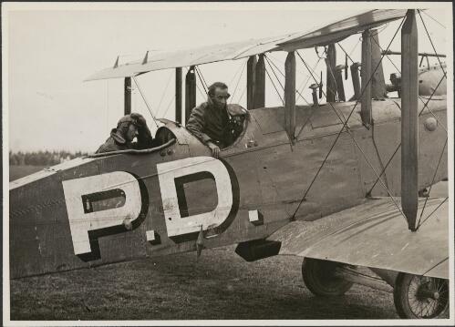 John McIntosh, seated, and Ray Parer, standing, in an Airco DH 9, P.D., 1920 [picture] / Sydney Morning Herald and Sydney Mail
