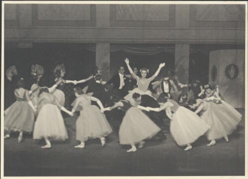 Irina Baronova as the Daughter of the House (centre with arms held up) and artists of the company, in Cotillon, Covent Garden Russian Ballet, Australian tour, His Majesty's Theatre, Melbourne, October 1938 [picture] / Hugh P. Hall
