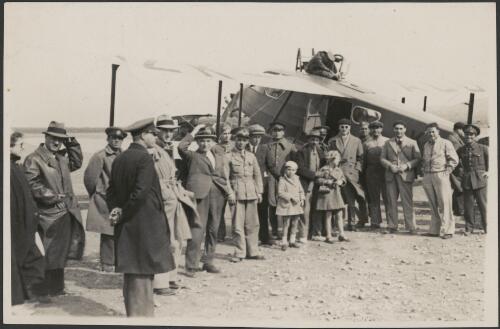 Crowd gathered next to De Havilland DH 89A Dragon Six biplane, ZK-ACO, flown by J.D. Hewett, F. Stewart, and Cyril Kay, Centenary Air Race, 1934 [picture] / Stewart & White Ltd., Auckland, N.Z