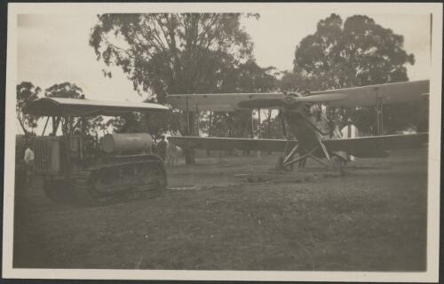 Les Holden's De Havilland DH 61 Giant Moth biplane 'Canberra', being towed by Caterpillar tractor [picture]