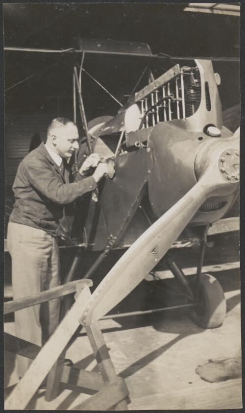 Portrait of Monty Fowler in De Havilland hangar, Mascot [picture] / E.A. Crome, Sydney