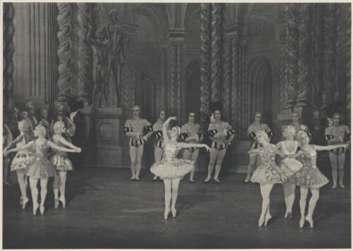 Alexandra Denisova (centre front), Paul Petroff (rear row fourth from right), Marian Ladre (rear row third from right), Michel Panaieff (rear row second from right), and artists of the company, in Le mariage d'Aurore, The Original Ballet Russe, Australian tour, His Majesty's Theatre, Melbourne, 1940 [picture] / Hugh P. Hall