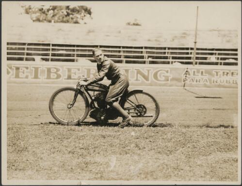 Guy Menzies riding a motorbike at a speedway, Sydney, 1920s [picture]