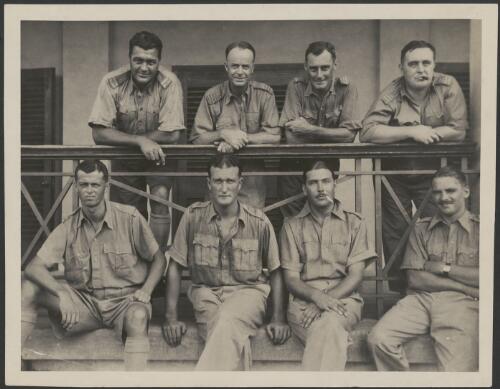 Guy Menzies, on the front row far right, pictured with 7 unidentified men dressed in uniform, 1930s [picture]