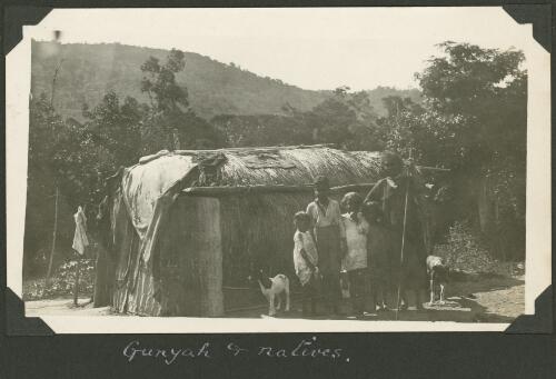 Aboriginal woman and four children stand in front of their hut, Mossman, Queensland, ca. 1928 [picture] / Charles Maurice Yonge