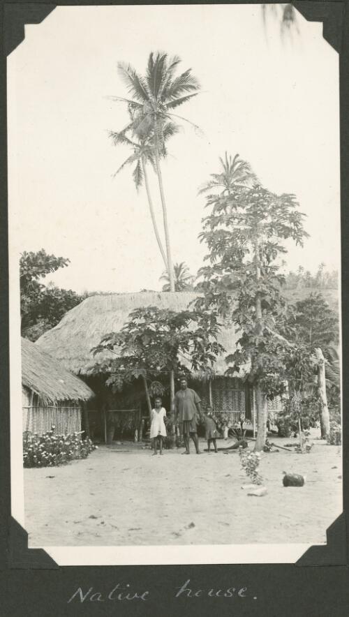 An islander and his children stand in front of their house, Meer Island, Queensland, ca. 1928 [picture] / Charles Maurice Yonge