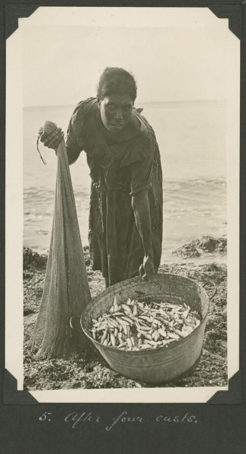 Islander displays the size of the catch after four net casts, Meer Island, Queensland, ca. 1928 [picture] / Charles Maurice Yonge