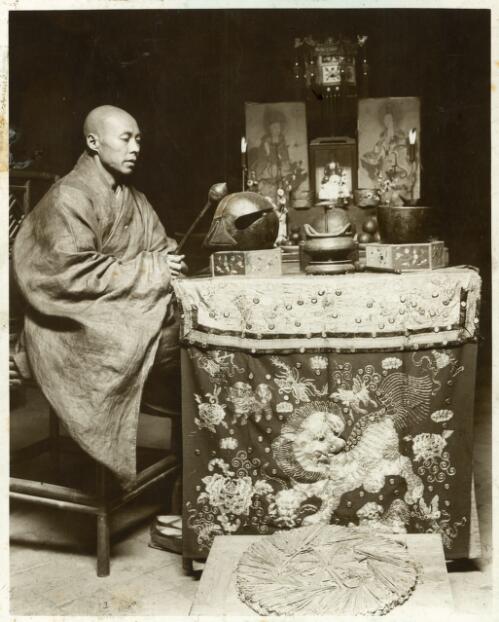 A priest at worship in a temple at Kanchowfu [picture]