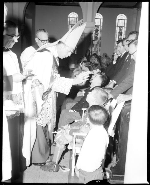 Children with a disability being blessed during confirmation at Blessed Sacrament Church, Clifton Gardens, 21 October, 1967 [picture] / John Mulligan
