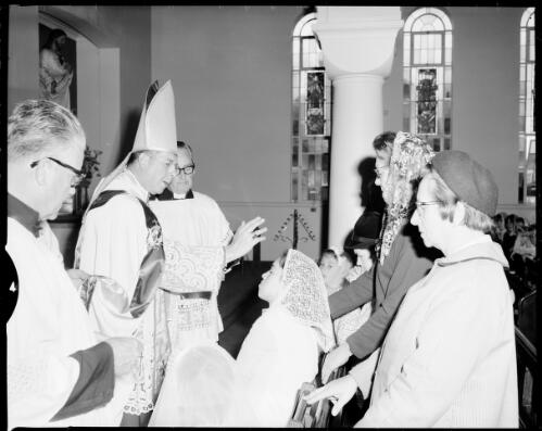 Young girl with a disability being blessed at the Blessed Sacrament Church, Clifton Gardens, 21 October, 1967 [picture] / John Mulligan
