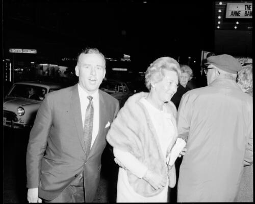 An unidentified man and woman outside the Hoyts Mayfair Theatre at the premiere of The graduate, Sydney, 28 July, 1968 [1] [picture] / John Mulligan