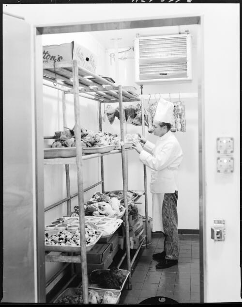 An unidentified chef in the cold storage refrigeration unit at the Ansett Flight Catering Centre, Mascot Airport, 15 July, 1968 [picture] / John Mulligan