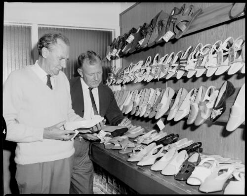 Two employees looking at shoes at Dunlop Footwear, Kingsgrove or Mortdale 17 July 1968 [picture] / John Mulligan
