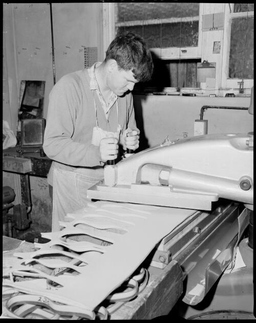 Factory worker cutting soles at Dunlop Footwear plant, Kingsgrove or Mortdale 17 July 1968 [picture] / John Mulligan